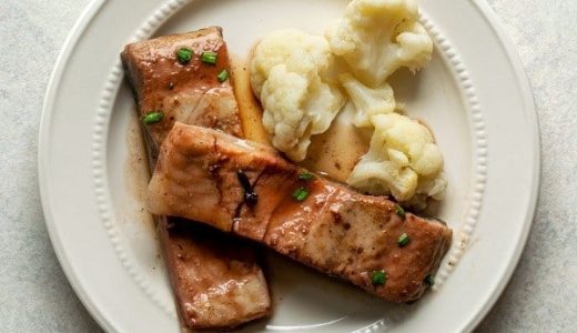 Black carp on plums and cauliflower garnish