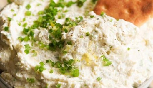 A bowl with a creamy celery and sweet apple spread for sandwiches.