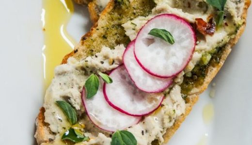 Buns decorated with spread and radish.