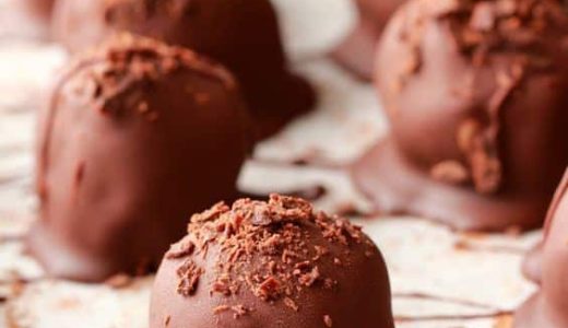 Chocolate balls sprinkled with cocoa.