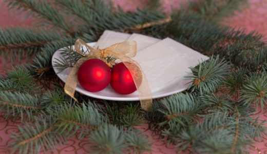 Gluten-free wafers on a plate with Christmas decorations.