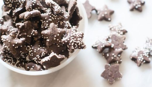 Coffee candy, in the shape of stars, sprinkled with white confectionery decoration.