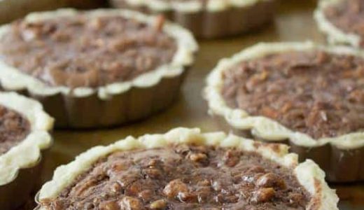 Small cupcakes with walnuts in a mold.