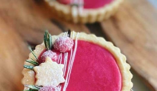 Sweet cupcakes with pink cranberry filling, beautifully decorated.