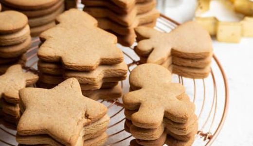 Different shapes of gluten-free gingerbread on a tray.