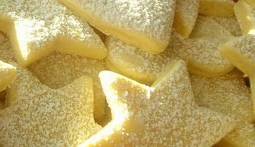 Star-shaped lemon cookies sprinkled with sugar.