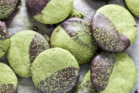 Green Christmas cookies dipped in chocolate.