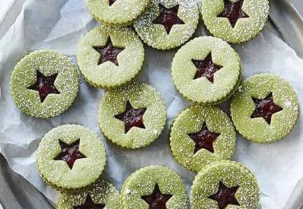 Green gummy cookies filled with jam.