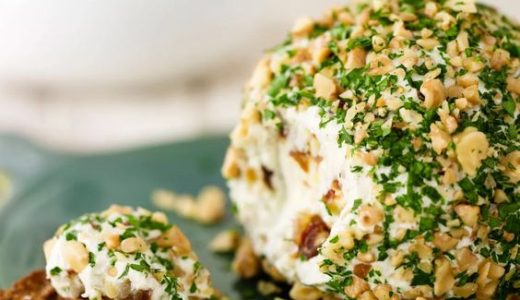 Cheese ball with nuts and parsley.