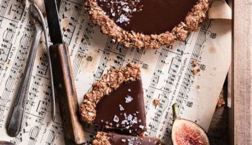 A sweet cupcake filled with chocolate cream and decorated with fresh figs.
