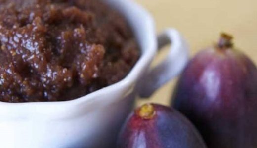 Fig paste in a bowl with fresh figs.