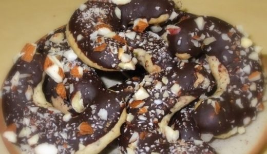 Half-dipped cookies with hazelnuts.